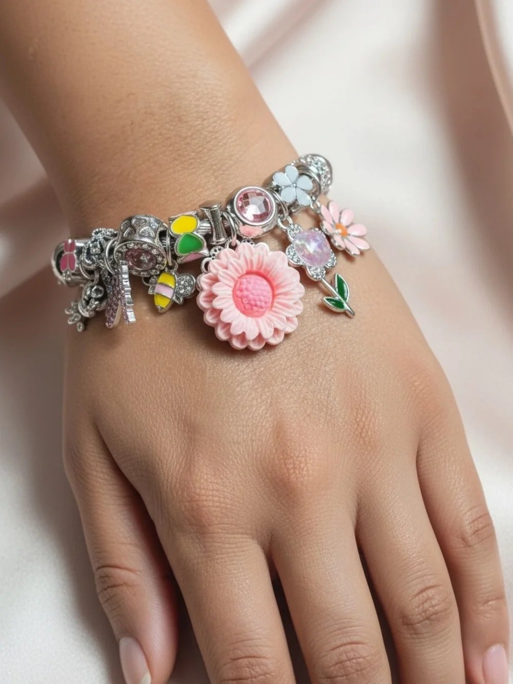 Silver Charm Adjustable Twisted Bangle with Pink Flower and Crystal Accents